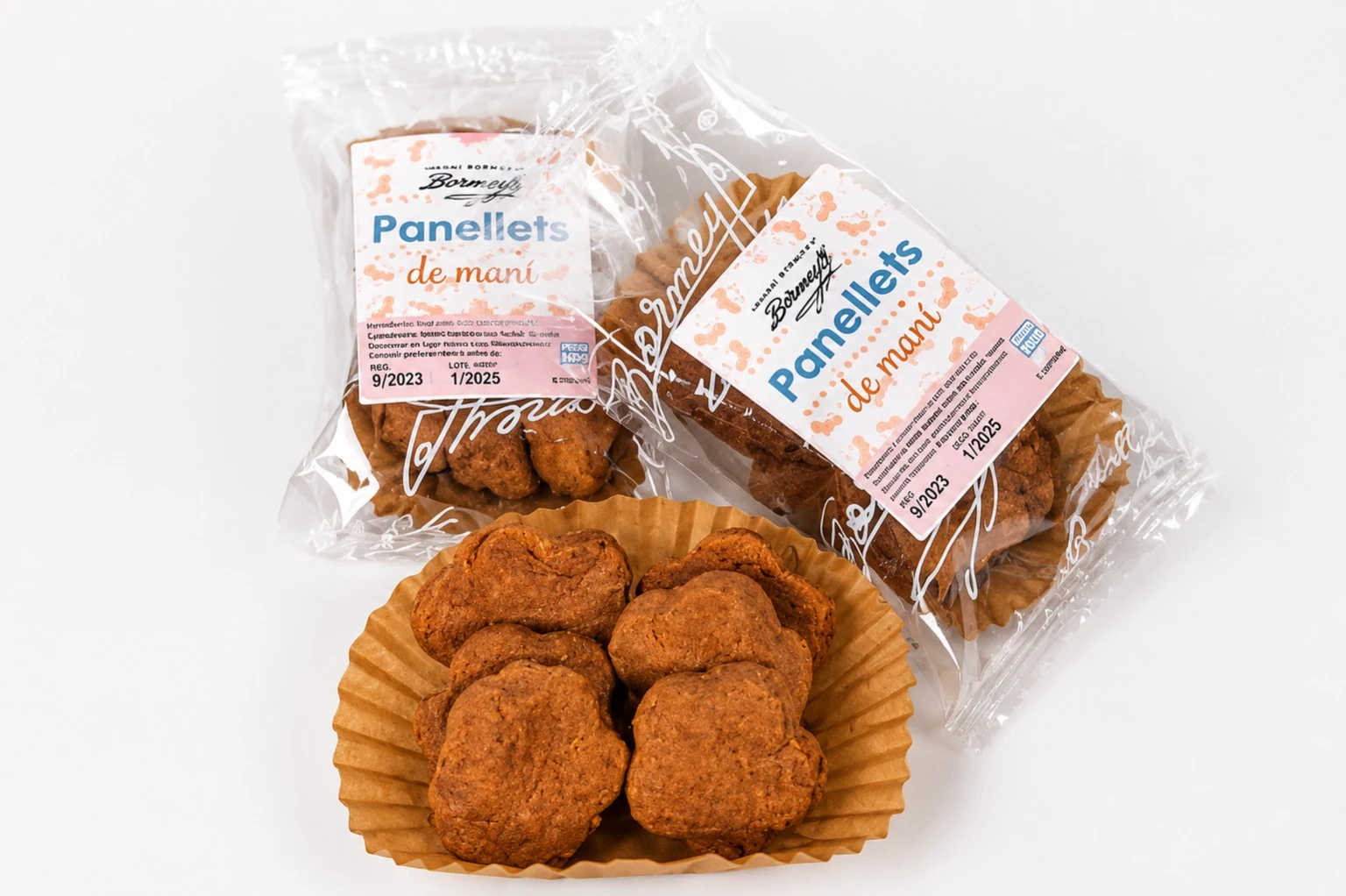 Panellets de maní BORMEY presentados en sus envases y en una cápsula de papel
